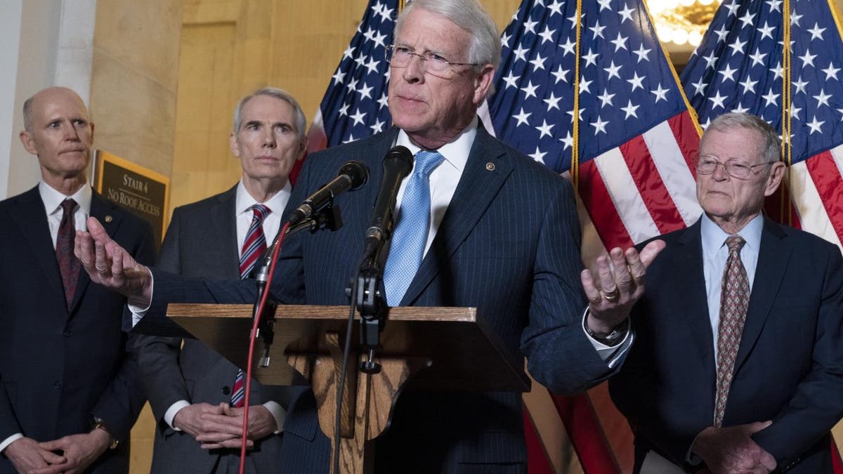 Sen. Roger Wicker, R-Miss., center, accompanied by Sen. Rick Scott, R-Fla., Sen. Rob Portman, R-Ohio, and Sen. Jim Inhofe, R-Okla. speaks during the Senate Armed Services and Senate Foreign Relations GOP news conference on Capitol Hill in Washington, Wednesday, Jan. 19, 2022. 