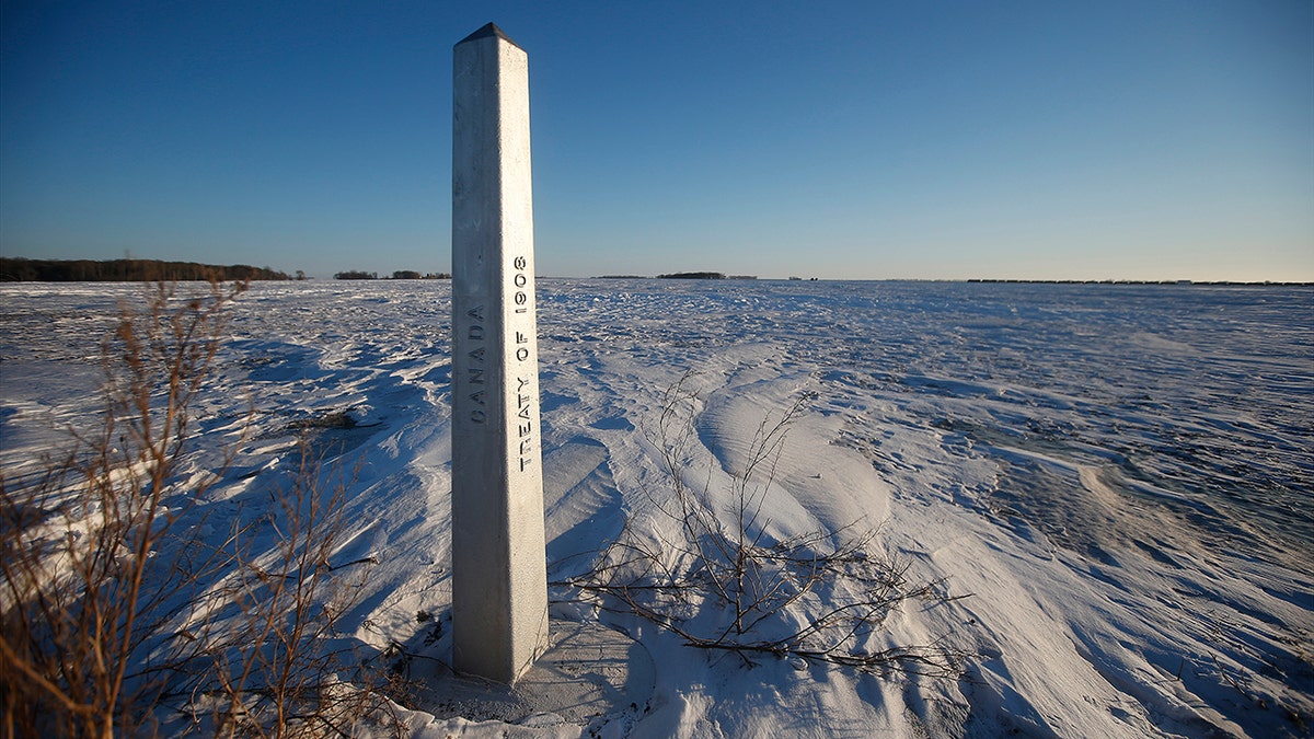 A border marker, between the United States and Canada is shown just outside of Emerson, Manitoba, on Thursday, Jan. 20, 2022. 