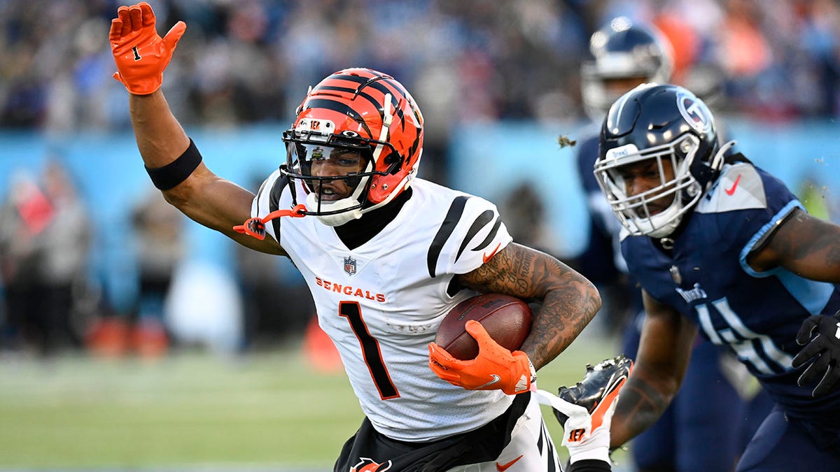 Cincinnati Bengals wide receiver Ja'Marr Chase (1) runs against the Tennessee Titans during the first half of an NFL divisional round playoff football game, Saturday, Jan. 22, 2022, in Nashville, Tenn.