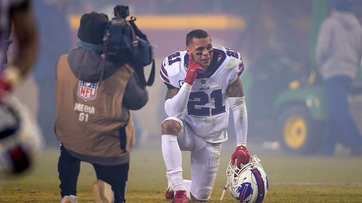 Buffalo Bills free safety Jordan Poyer (21) kneels on the field after an NFL divisional round playoff football game against the Kansas City Chiefs, Sunday, Jan. 23, 2022, in Kansas City, Mo. The Chiefs won 42-36 in overtime.