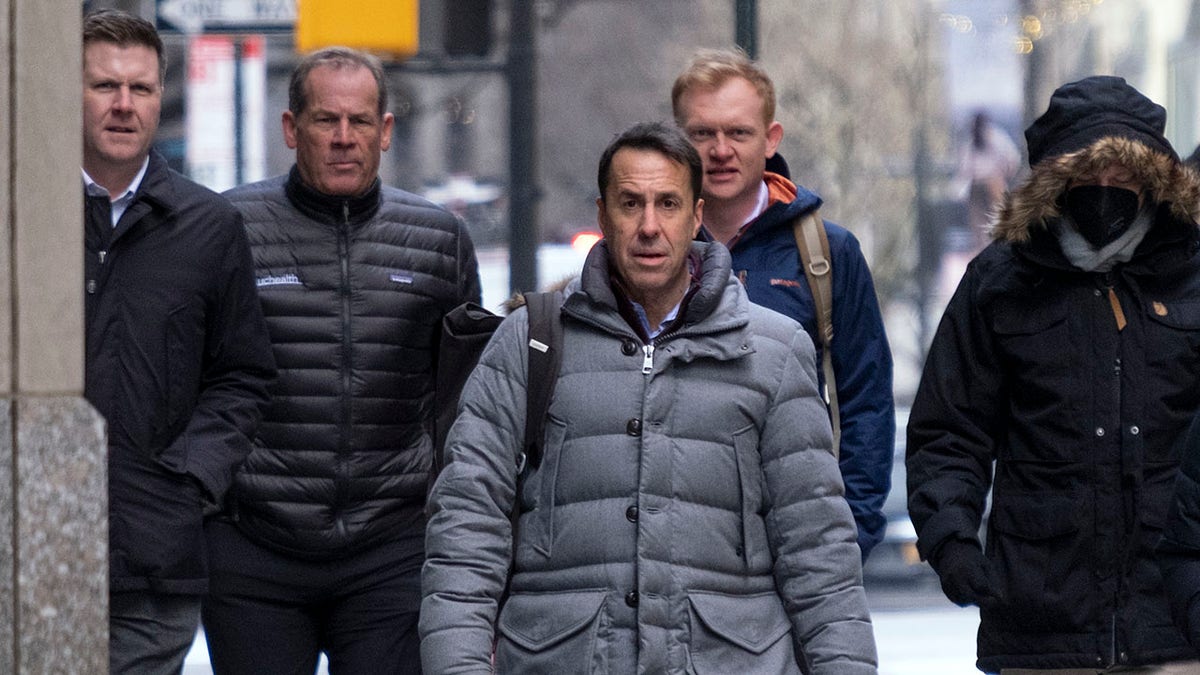 Major League Baseball deputy commissioner Dan Halem, center, arrives for a meeting in New York, Monday, Jan. 24, 2022, for the first in-person baseball negotiating session since the MLB lockout began. At far left is Patrick Houlihan, Senior Vice President &amp;amp; Deputy General Counsel, Labor Relations at Major League Baseball, second from left is Colorado Rockies owner Dick Montfort, and behind Halem is executive vice president Morgan Sword.