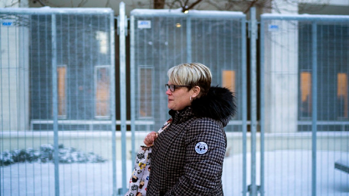 George Floyd's girlfriend Courtney Ross leaves the U.S. Federal Courthouse after the first day of testimony in the federal trial of three former Minneapolis police officers implicated in Floyd's death on Monday, Jan. 24, 2022, in St. Paul, Minn.