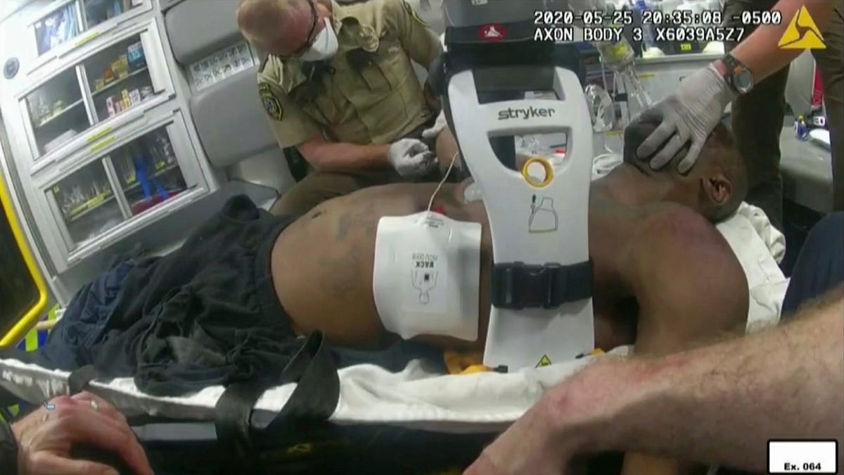 This image from police body camera video shows emergency personal tending to George Floyd after he had been loaded into an ambulance on May 25, 2020, in Minneapolis.