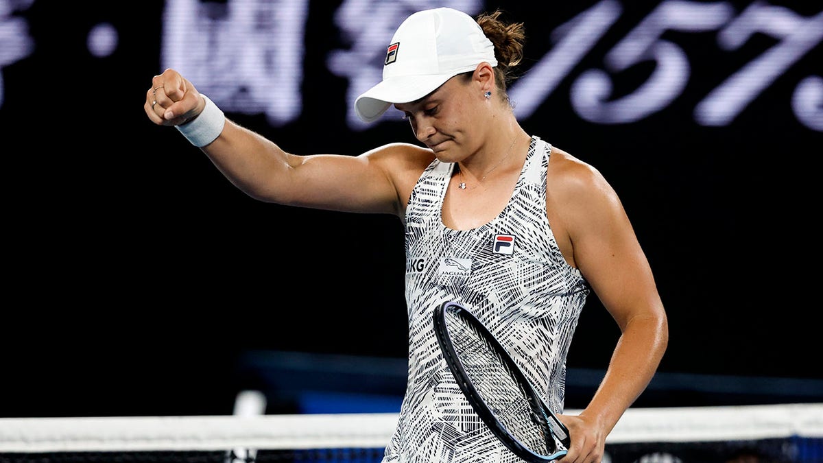 Ash Barty of Australia reacts after defeating Madison Keys of the U.S. in their semifinal match at the Australian Open tennis championships in Melbourne, Australia, Thursday, Jan. 27, 2022.