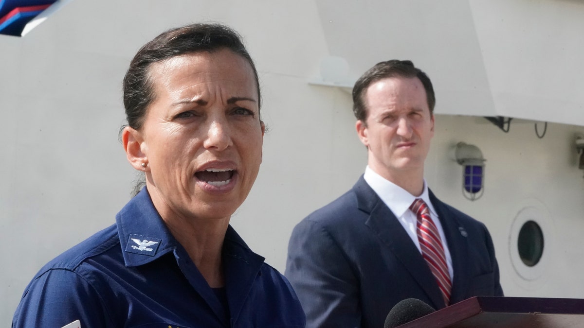 U.S. Coast Guard Capt. Jo-Ann Burdian, foreground, speaks along with Homeland Security Investigations Special Agent in Charge in Miami Anthony Salisbury, rear, during a news conference, Thursday, Jan. 27, 2022, at Coast Guard Sector Miami in Miami Beach, Florida.?