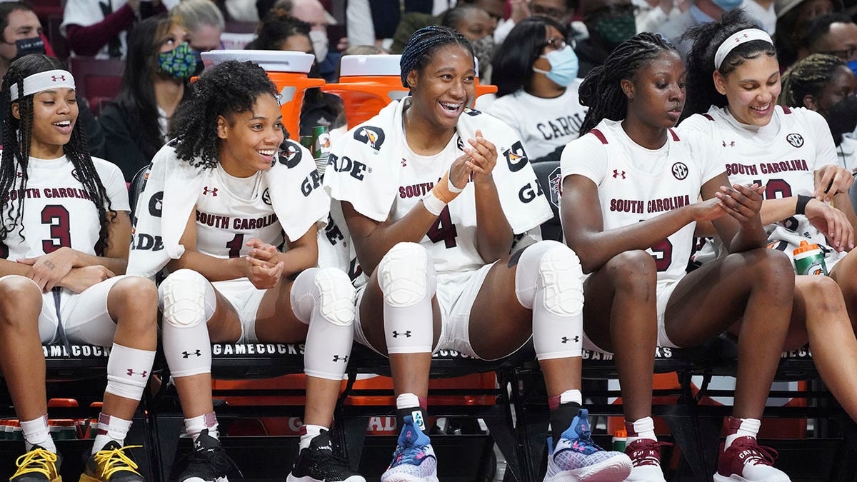 South Carolina guard Destanni Henderson (3), Zia Cooke (1), Aliyah Boston (4), Laeticia Amihere (15) and Kamilla Cardoso, right, watch from the bench during the second half of an NCAA college basketball game against Mississippi Thursday, Jan. 27, 2022, in Columbia, S.C. South Carolina won 69-40.