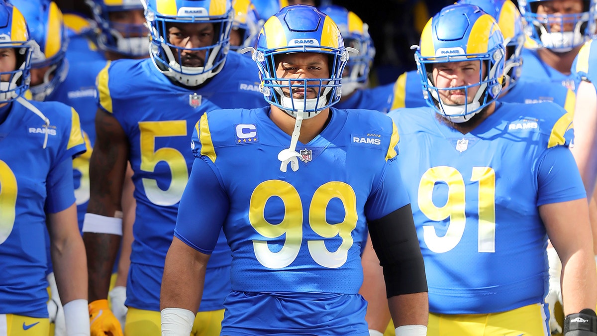 Los Angeles Rams defensive lineman Aaron Donald (99) is set to lead the Rams onto the field before the NFC Divisional game between the Los Angeles Rams and the Tampa Bay Buccaneers on Jan. 23, 2022, at Raymond James Stadium in Tampa, Florida.