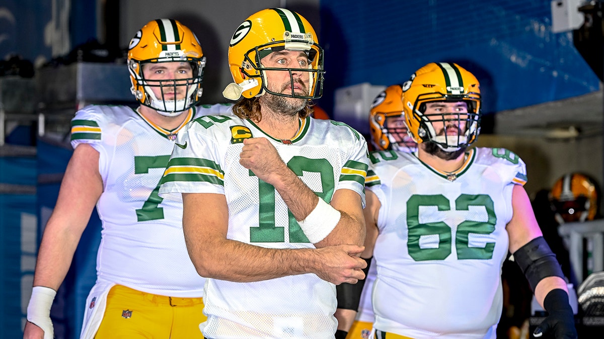 Aaron Rodgers (12) of the Green Bay Packers leads his team out before the game against the Detroit Lions at Ford Field on Jan. 9, 2022, in Detroit, Michigan.