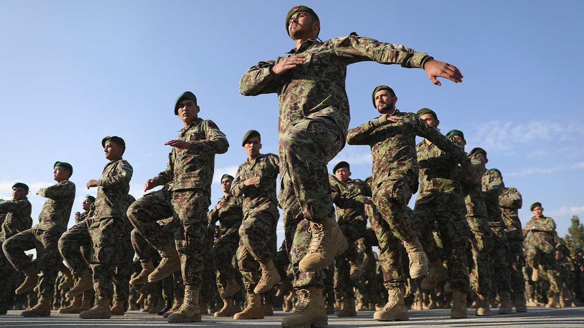 Newly graduated Afghan National Army personnel march during their graduation ceremony after a three-month training program at the Afghan Military Academy in Kabul, Afghanistan, in November 2020.