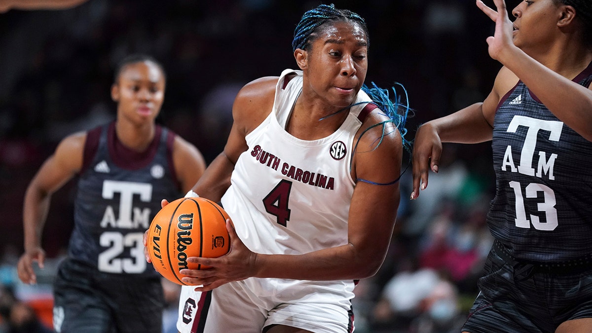 South Carolina forward Aliyah Boston (4) drives to the hoop against Texas A&amp;amp;M forward Jada Malone (13) during the first half of an NCAA college basketball game Thursday, Jan. 13, 2022, in Columbia, S.C.