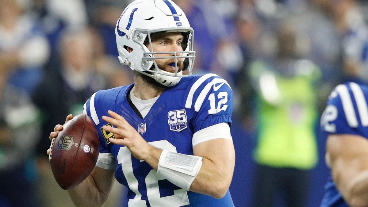 Andrew Luck looks throws a pass for the Colts