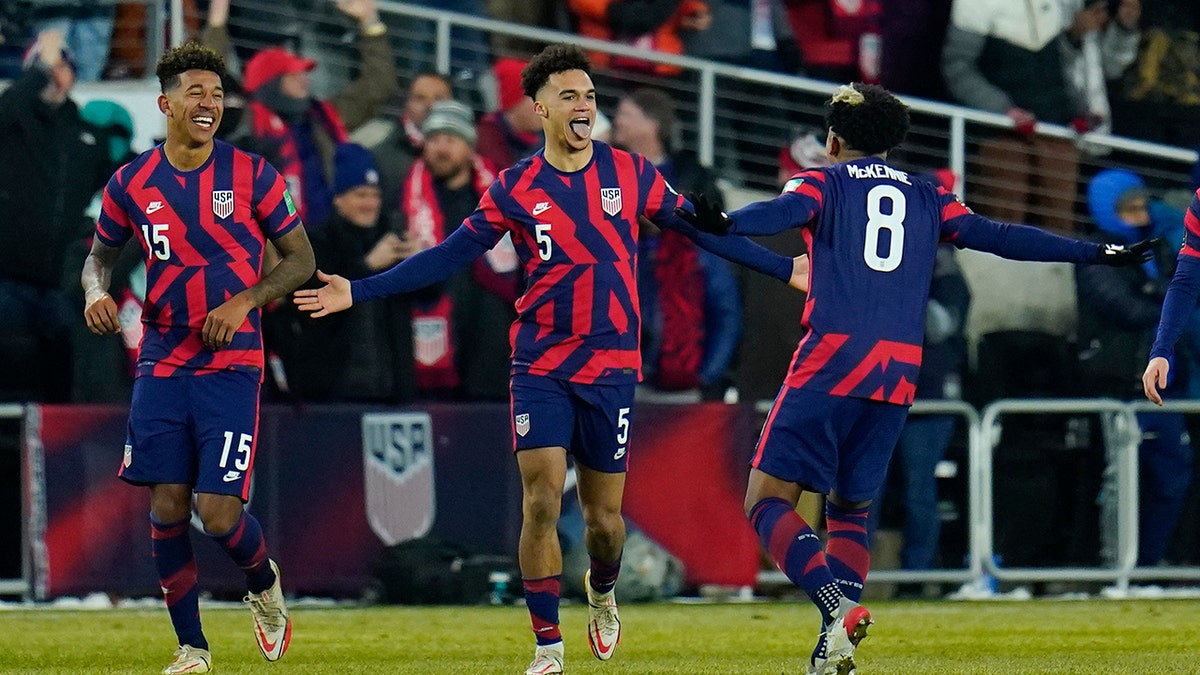 United States' Antonee Robinson (5) celebrates his goal with Weston McKennie (8) and Chris Richards (15) during the second half of a FIFA World Cup qualifying soccer match against El Salvador, Thursday, Jan. 27, 2022, in Columbus, Ohio.