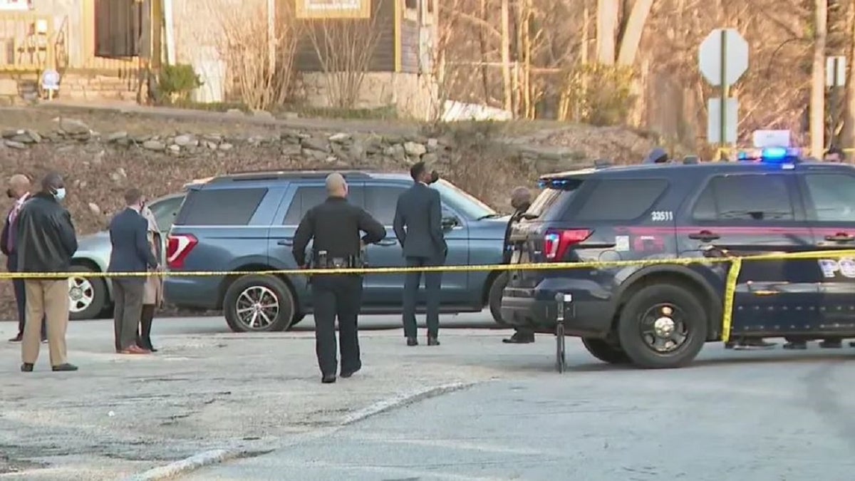 Atlanta investigators at the scene where a 6-month-old child was killed Monday. The child was the second to be killed and third to be shot this year. 
