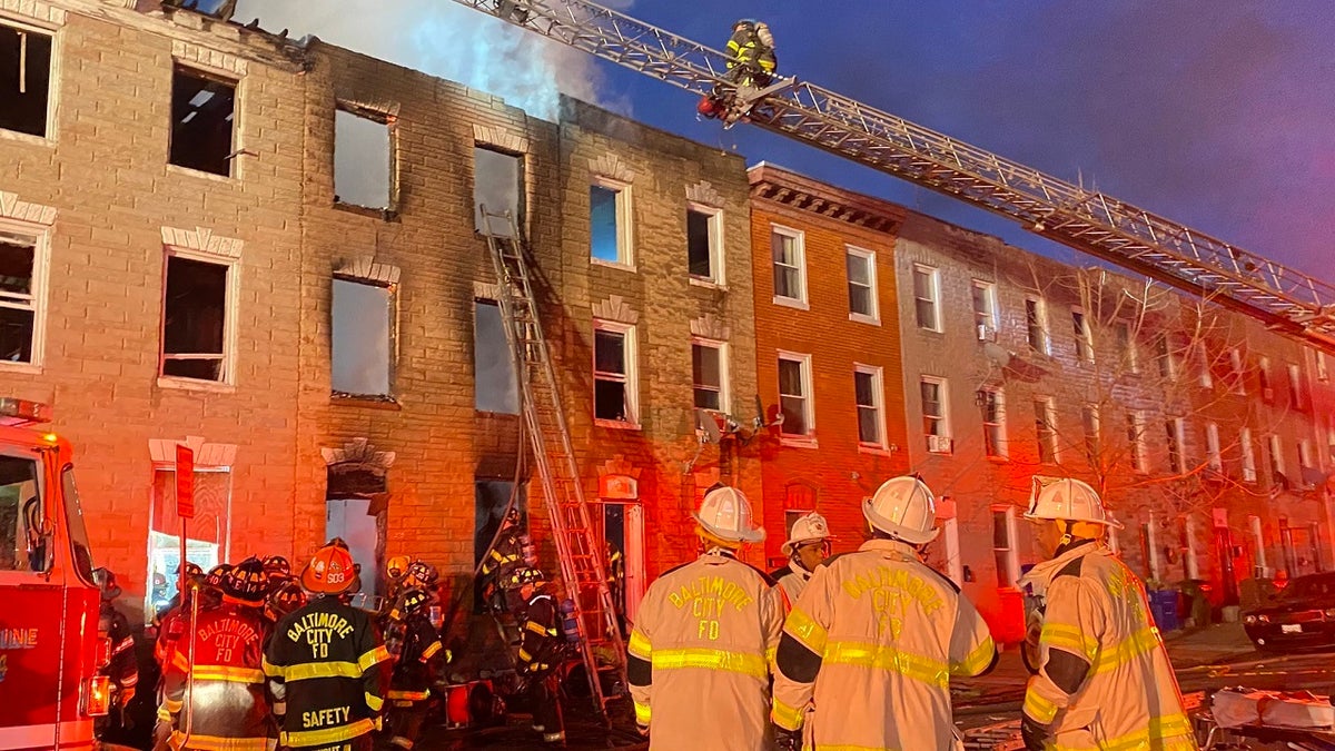 Photo shows Baltimore firefighters at scene of blaze on Jan. 24, 2022.