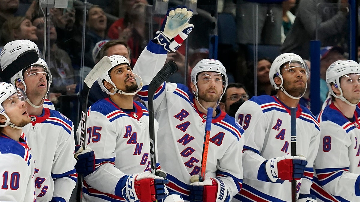 New York Rangers center Barclay Goodrow (21) waves to the crowd after the Tampa Bay Lightning played a video tribute to Goodrow during the first period of an NHL hockey game Friday, Dec. 31, 2021, in Tampa, Fla. Goodrow won a Stanley Cup with the Lightning.