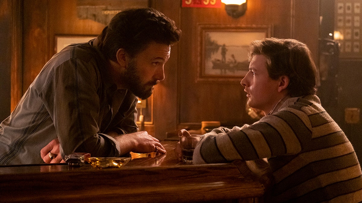 Ben Affleck, left, and Tye Sheridan in a scene from "The Tender Bar." 
