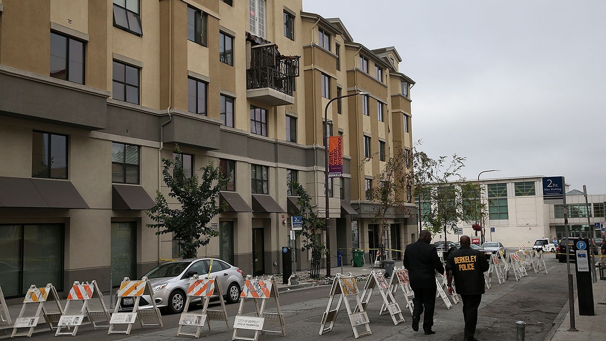 Police remain at the scene of a balcony collapse at an apartment building near UC Berkeley in 2015.