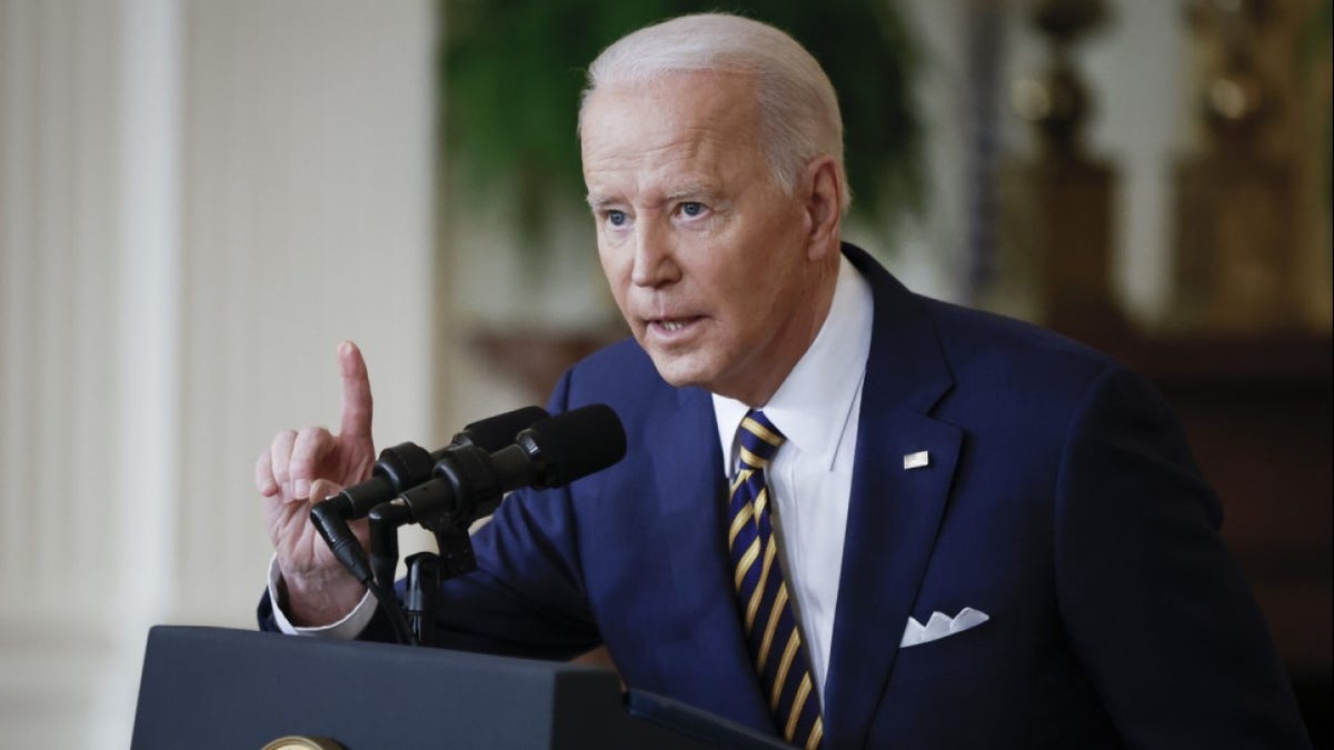 President Joe Biden speaks at a podium