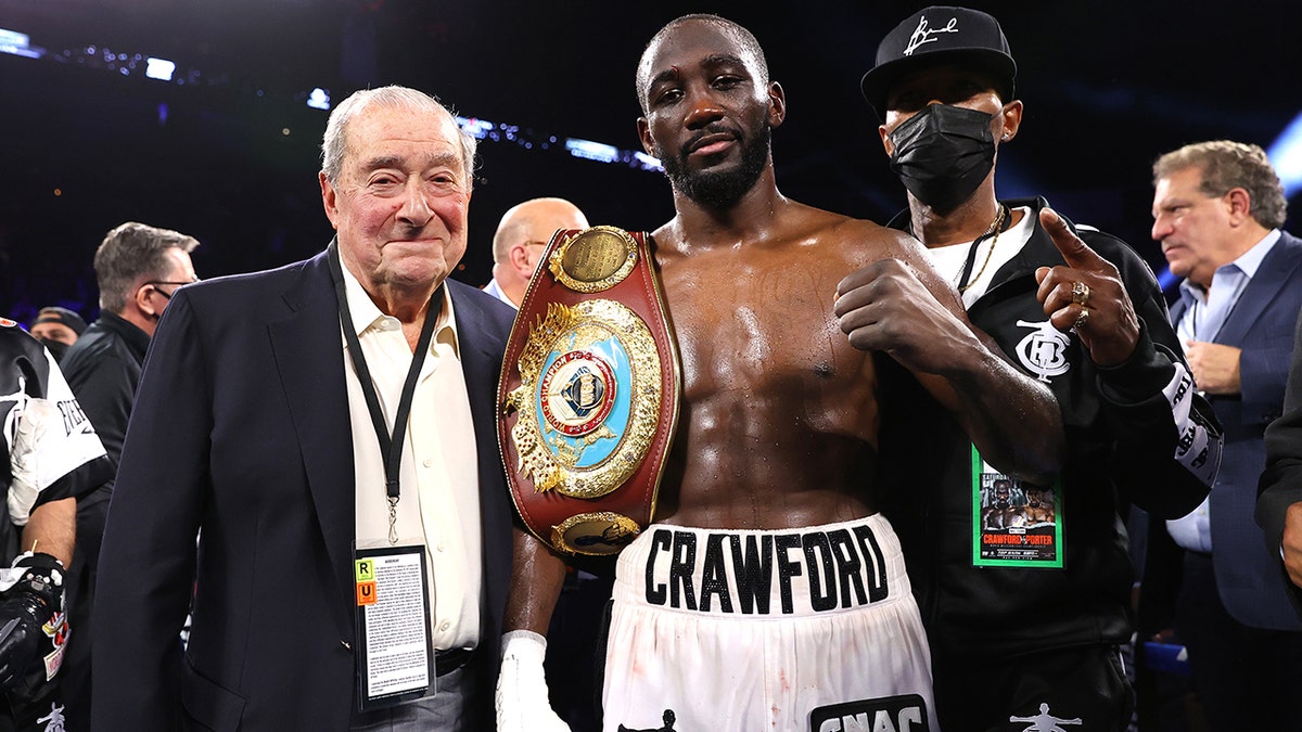 Bob Arum (L) and Terence Crawford (R) victory pose as he defeats Shawn Porter for the WBO welterweight championship at Michelob ULTRA Arena on November 20, 2021 in Las Vegas, Nevada.