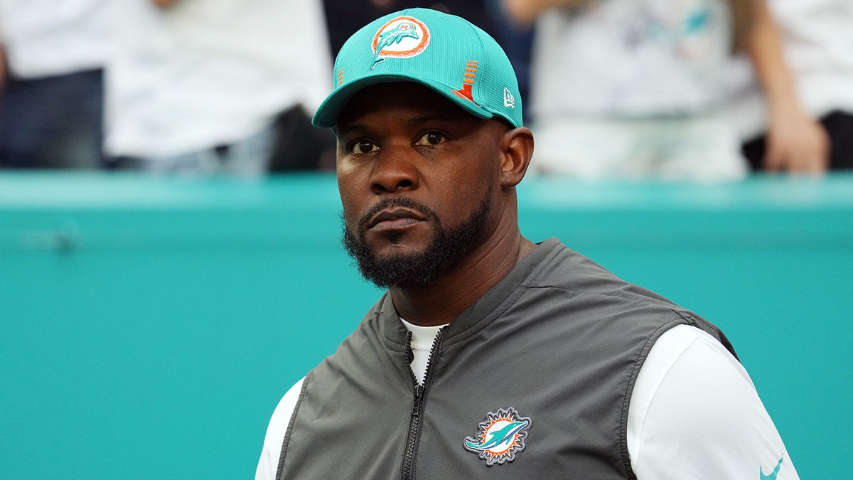 Brian Flores takes the field during introductions before the Jan. 9, 2022, game against the New England Patriots at Hard Rock Stadium in Miami Gardens, Florida.
