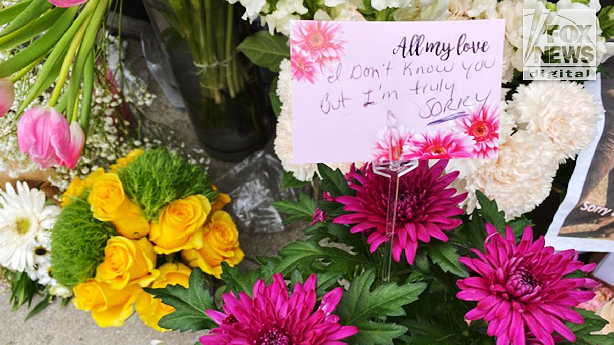 A note left with flowers was among the many bouquets left in front of the Croft House furniture shop in Los Angeles where Brianna Kupfer was killed on Jan. 13.