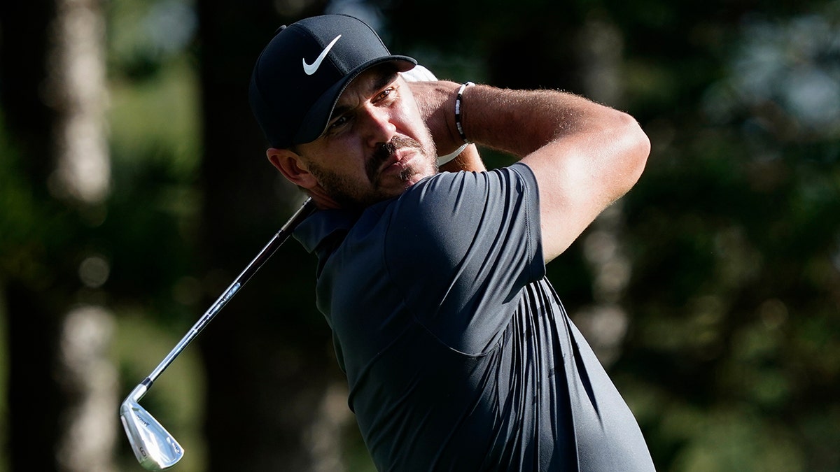 Brooks Koepka watches his tee shot on the second hole during the first round of the Tournament of Champions golf event, Thursday, Jan. 6, 2022, at Kapalua Plantation Course in Kapalua, Hawaii.
