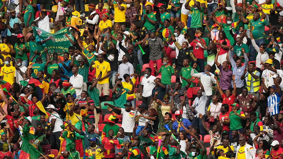 Fans reacts after Cameroon's captain Vincent Aboubakar, scored his team's first goal, during the African Cup of Nations 2022 group A soccer match between Cape Verde and Cameron at the Olembe stadium in Yaounde, Cameroon, Monday, Jan. 17, 2022. 