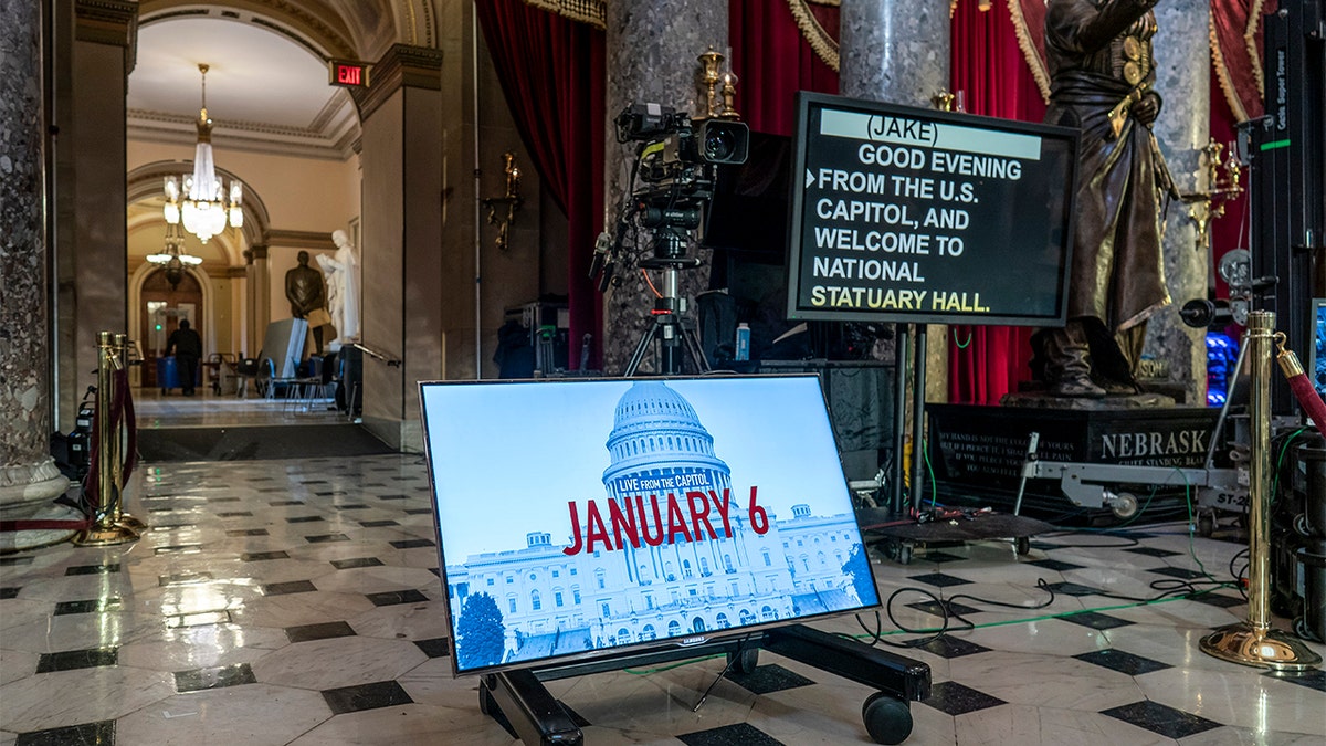A year after the Jan. 6 attack on the Capitol, television cameras and video monitors fill Statuary Hall in preparation for news coverage, on Capitol Hill in Washington, Wednesday, Jan. 5, 2022. (AP Photo/J. Scott Applewhite)
