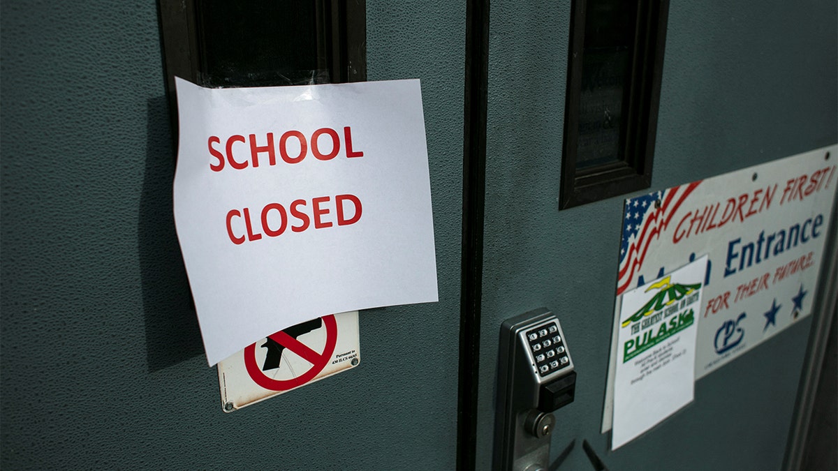 school closed sign taped on door