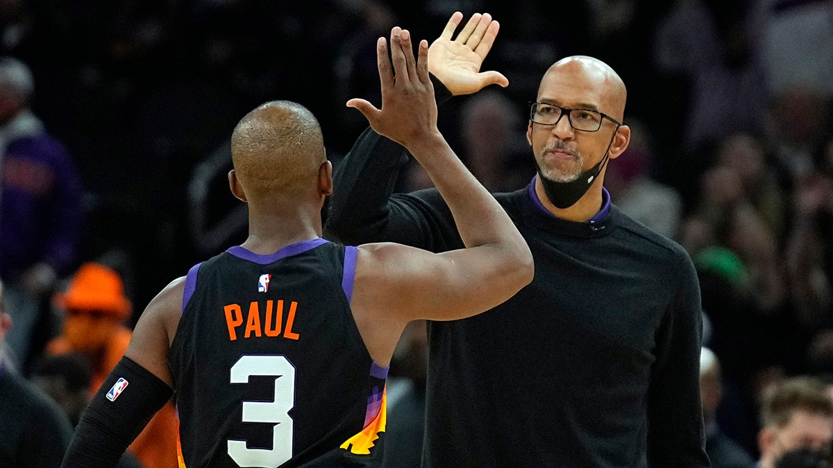 Phoenix Suns coach Monty Williams and guard Chris Paul (3) reacts after a timeout during the second half of the team's NBA basketball game against the Los Angeles Clippers, Thursday, Jan. 6, 2022, in Phoenix. The Suns won 106-89.
