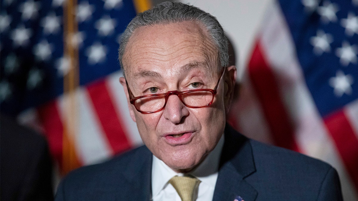 Senate Majority Leader Chuck Schumer responds to questions from reporters during a press conference at the Capitol on Jan. 18, 2022.