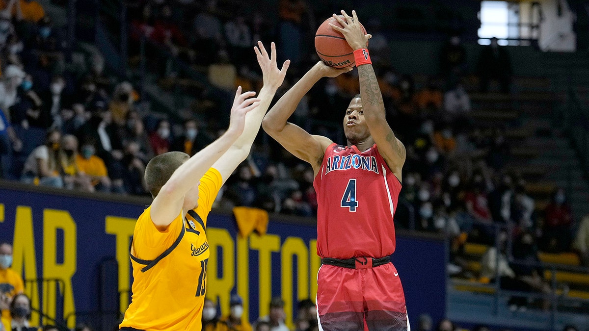Arizona guard Dalen Terry (4) shoots a 3-pointer over California forward Grant Anticevich (15) during the first half of an NCAA college basketball game in Berkeley, Calif., Sunday, Jan. 23, 2022.