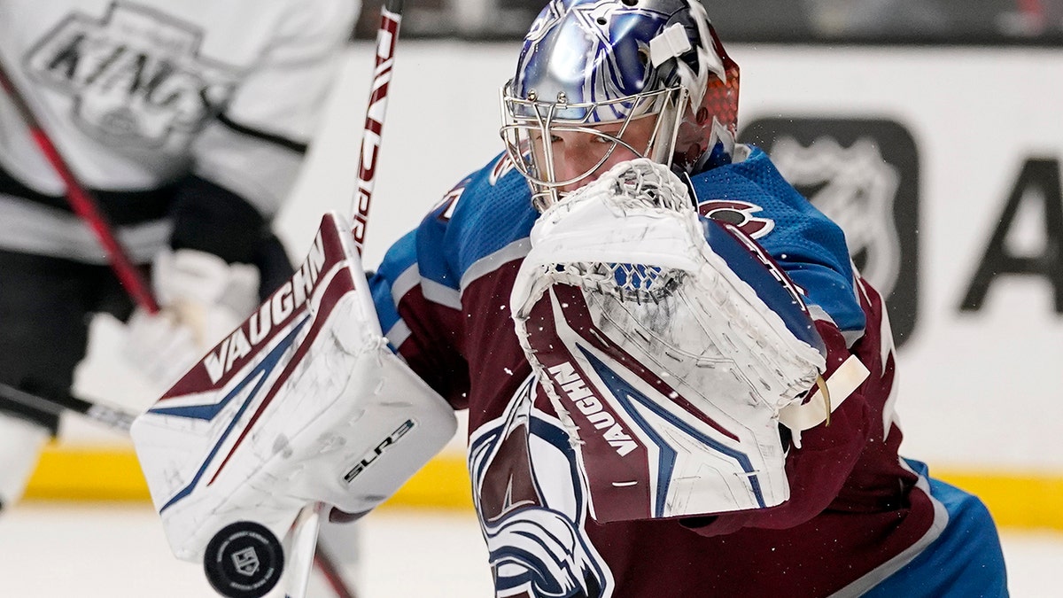 Colorado Avalanche goaltender Darcy Kuemper deflects a shot during the second period of an NHL hockey game against the Los Angeles Kings Thursday, Jan. 20, 2022, in Los Angeles.