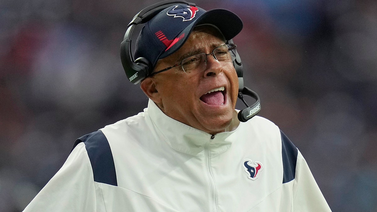 Houston Texans head coach David Culley questions a call during the first half of an NFL football game against the Tennessee Titans, Sunday, Jan. 9, 2022, in Houston.