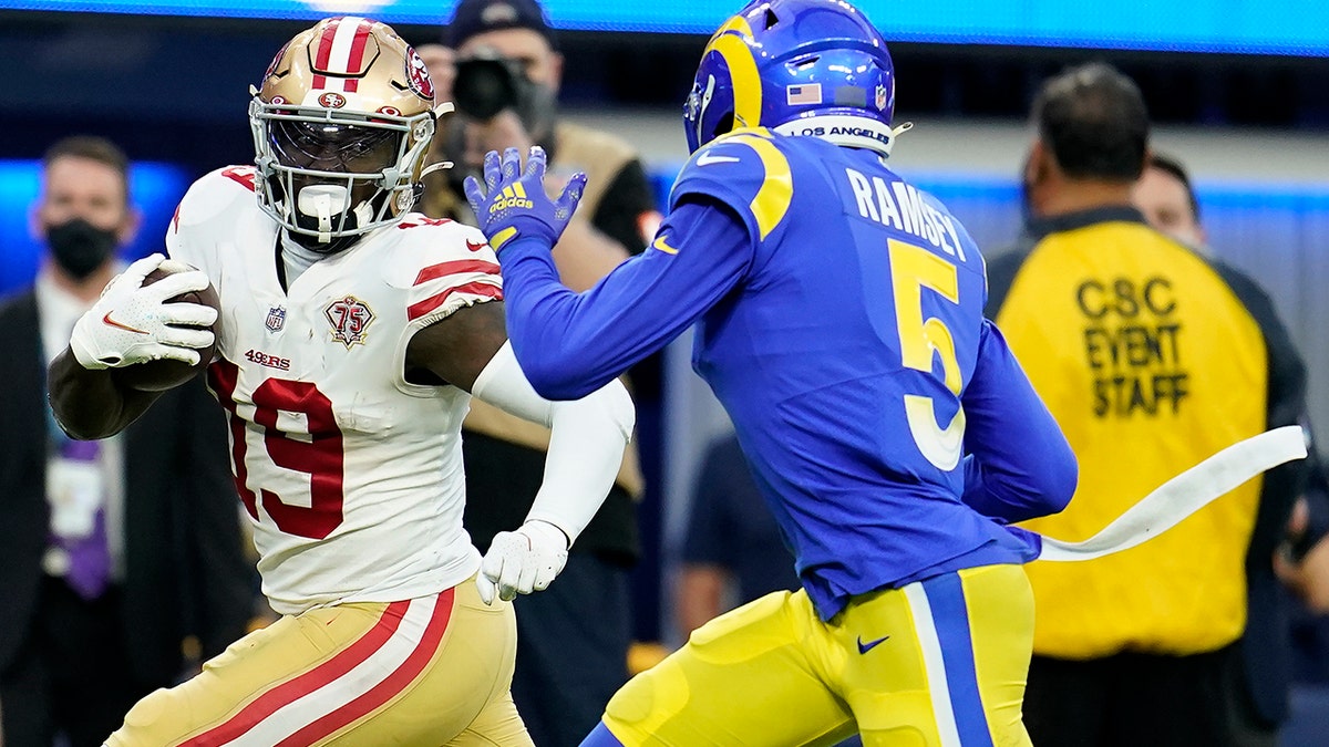 San Francisco 49ers' Deebo Samuel (19) gets past Los Angeles Rams' Jalen Ramsey for a touchdown during the first half of the NFC Championship NFL football game Sunday, Jan. 30, 2022, in Inglewood, Calif.