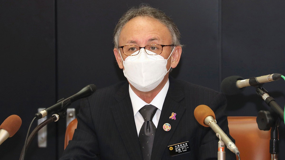 Okinawa Gov. Denny Tamaki speaks to the media at the prefectural headquarters in Naha, southern Japan, Thursday, Jan. 6, 2022.