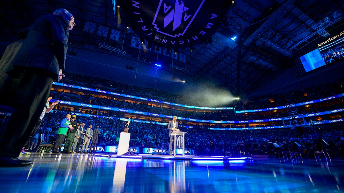 Jan 5, 2022; Dallas, Texas, USA; Former Dallas Mavericks player Dirk Nowitzki speaks to the fans as he has his number 41 jersey retired after the game between the Dallas Mavericks and the Golden State Warriors at the American Airlines Center.