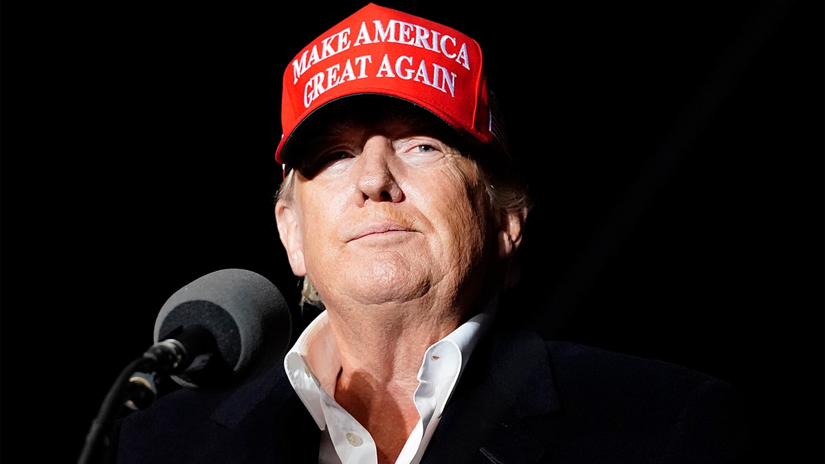 Trump wearing a Make America Great Again hat at a rally