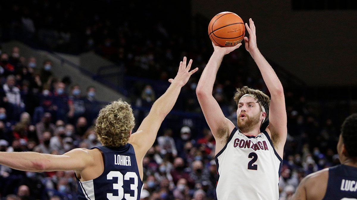 Gonzaga forward Drew Timme (2) shoots over BYU forward Caleb Lohner (33) during the second half of an NCAA college basketball game, Thursday, Jan. 13, 2022, in Spokane, Wash. Gonzaga won 110-84.