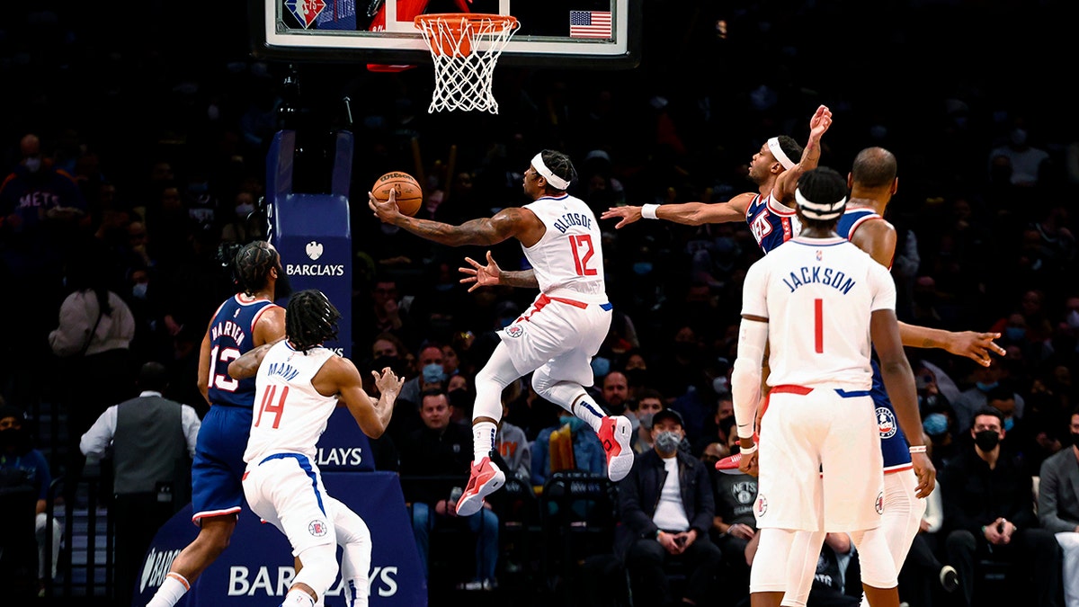Los Angeles Clippers guard Eric Bledsoe (12) shoots against the Brooklyn Nets during the first half of an NBA basketball game Saturday, Jan. 1, 2022, in New York. 