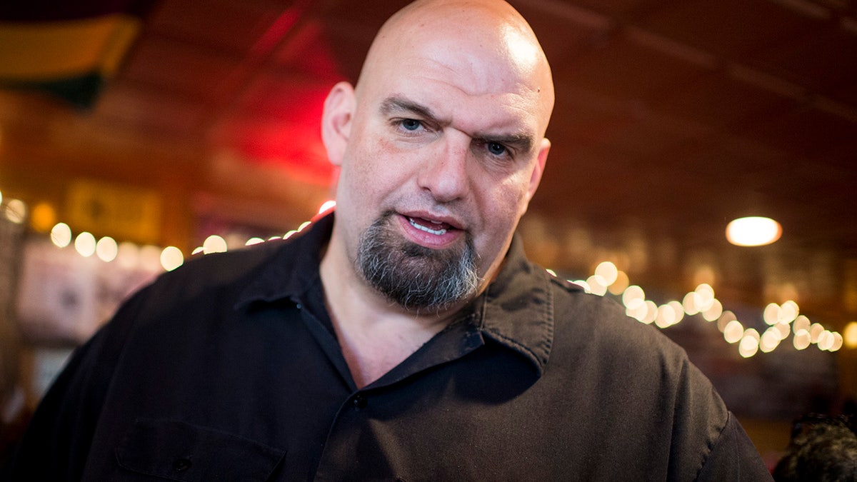U.S. Senate candidate John Fetterman speaks with supporters during his meet- and-greet campaign stop at the Interstate Drafthouse in Philadelphia. 