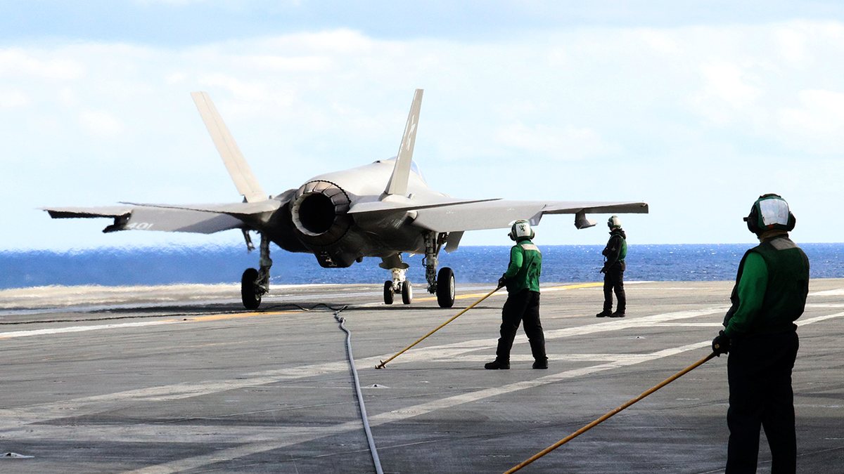 F-35C stealth jet sits on deck of USS Carl Vinson in the Western Pacific, south of Japan.