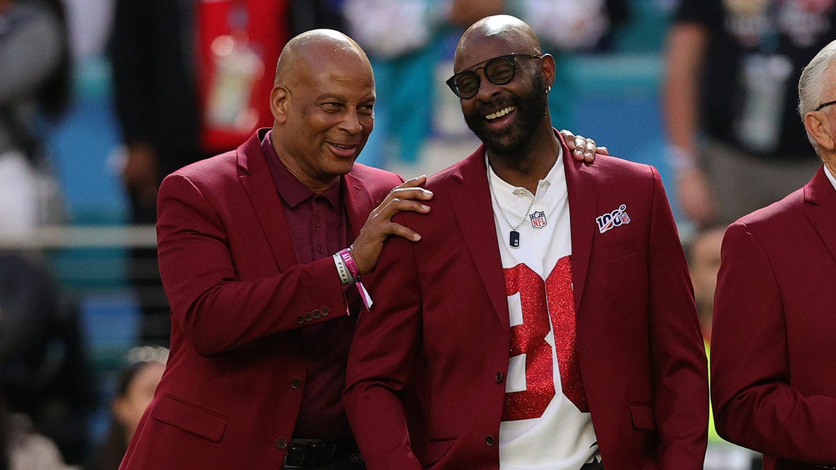 Ronnie Lott and Jerry Rice of the NLF 100 All-Time Team are honored on the field prior to Super Bowl LIV between the San Francisco 49ers and the Kansas City Chiefs at Hard Rock Stadium on Feb. 2, 2020 in Miami, Florida.