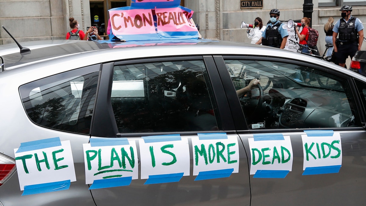 A protester's car displays the message "The Plan is More Dead Kids" during the Occupy City Hall Protest and Car Caravan hosted by Chicago Teachers Union in Chicago, Illinois, on Aug. 3, 2020. 