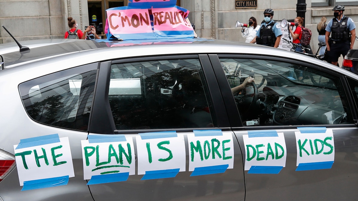 A protester's car displays the message "The Plan is More Dead Kids" during the Occupy City Hall Protest and Car Caravan hosted by Chicago Teachers Union in Chicago, Illinois, on Aug. 3, 2020.