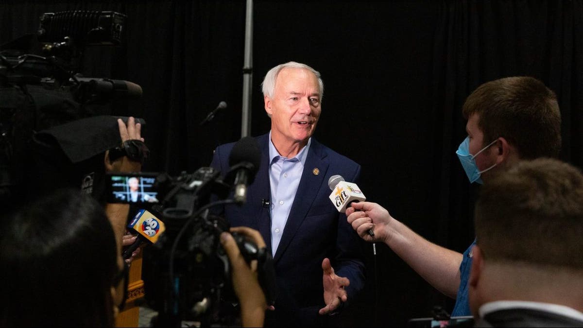 Asa Hutchinson, governor of Arkansas, speaks with members of the media on Monday, July 16, 2021.  Photographer: Liz Sanders/Bloomberg via Getty Images