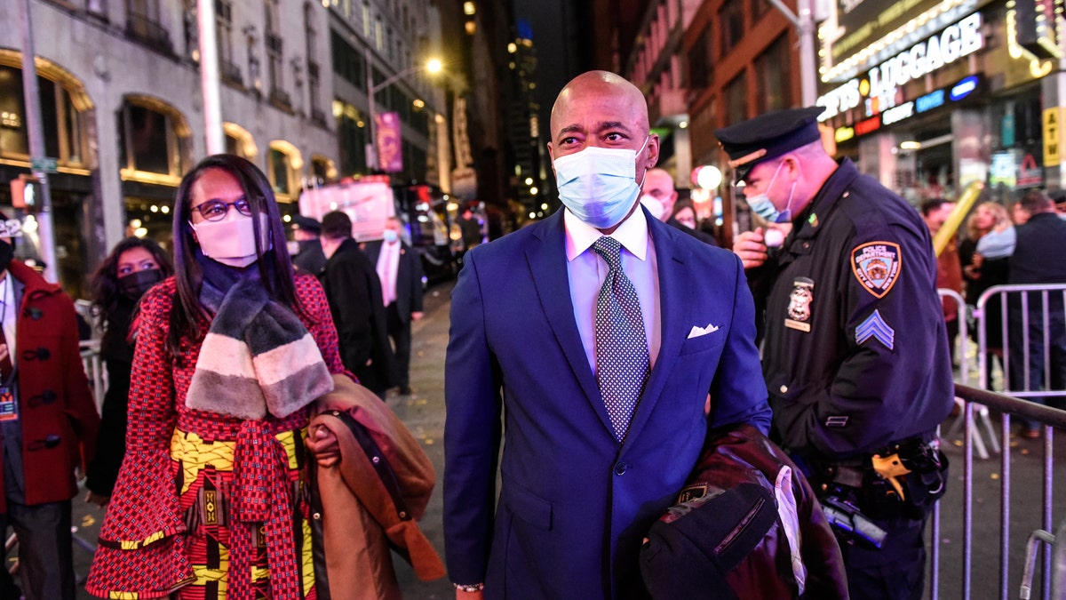 Eric Adams, incoming mayor of New York, right, arrives at a New Year's Eve celebration in the Times Square area of New York, U.S., on Friday, Dec. 31, 2021. Photographer: Stephanie Keith/Bloomberg via Getty Images