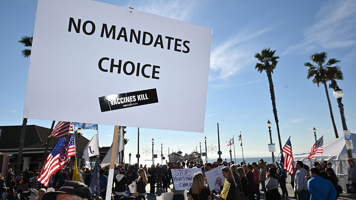 People demonstrate against COVID-19 vaccine mandates for students in Huntington Beach, California, on Jan. 3, 2022. 
