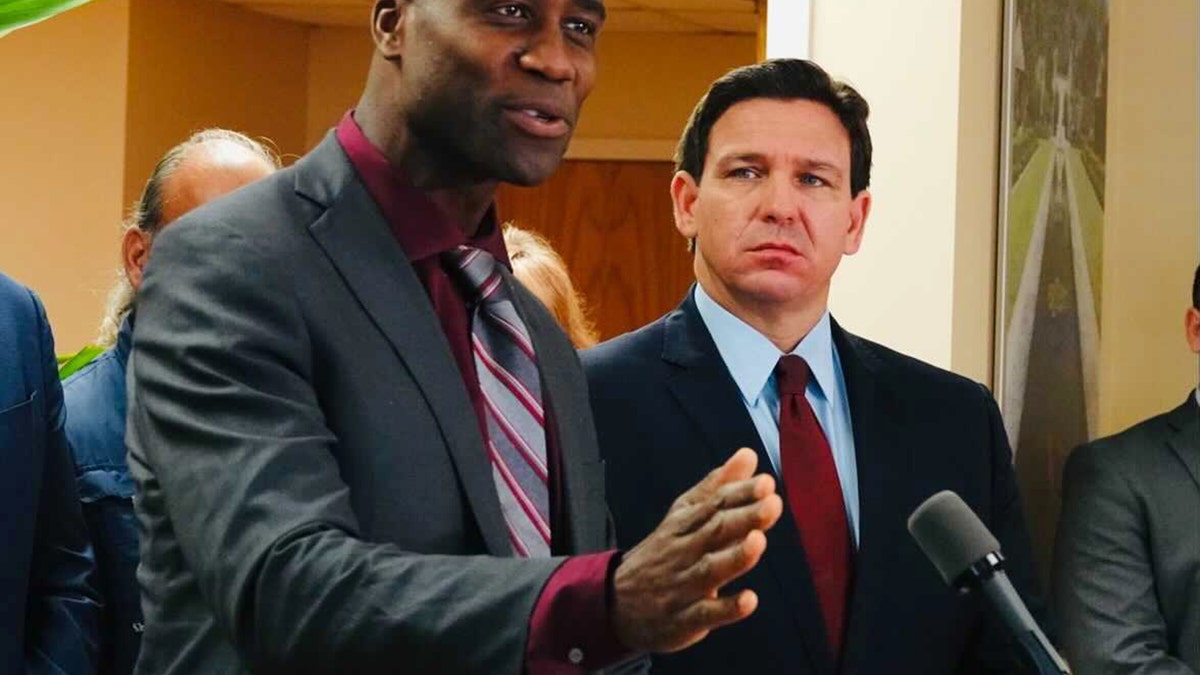 lorida Surgeon General Joseph Ladapo and Gov. Ron DeSantis in West Palm Beach