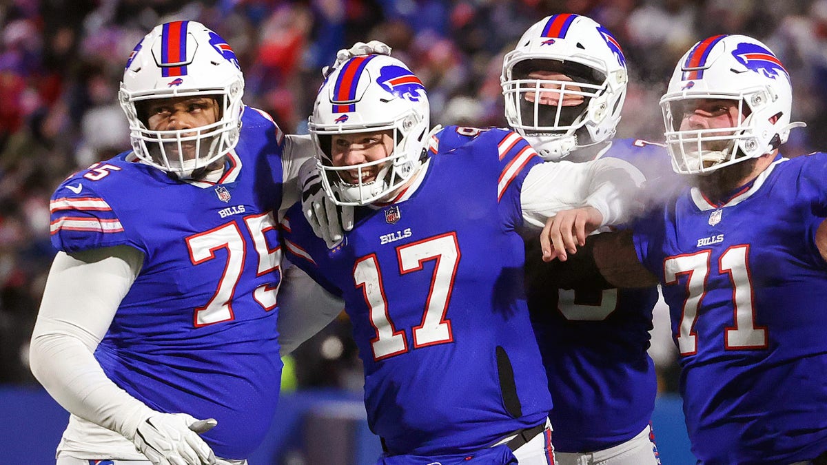 Buffalo Bills quarterback Josh Allen (17) celebrates his touchdown pass to wide receiver Gabriel Davis (13) in the fourth quarter. 